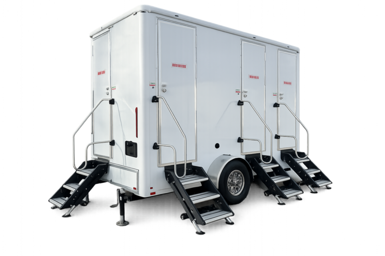 White portable restroom trailer rental in Omaha with three separate restroom doors, black stair steps, and metal handrails on a towable trailer base